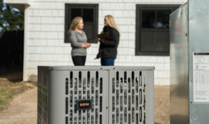 Sale representative and homeowner discussing new hvac system in Illinois.