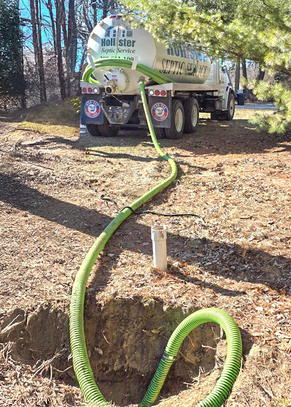 Septic pumping being performed by Hollister near Macomb Illinois.